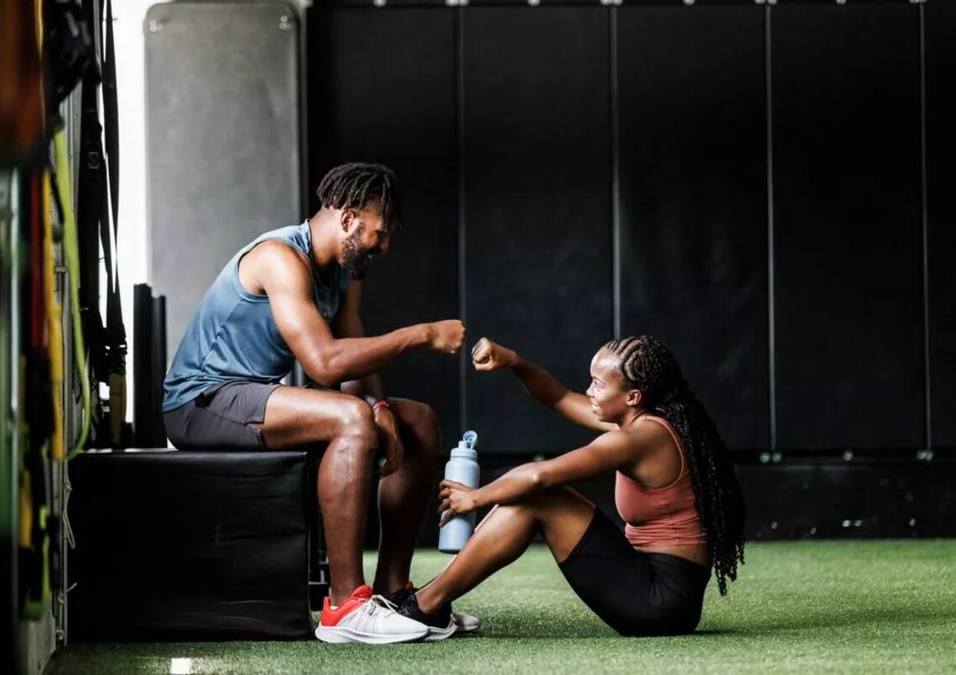 Girl & man IN the gym