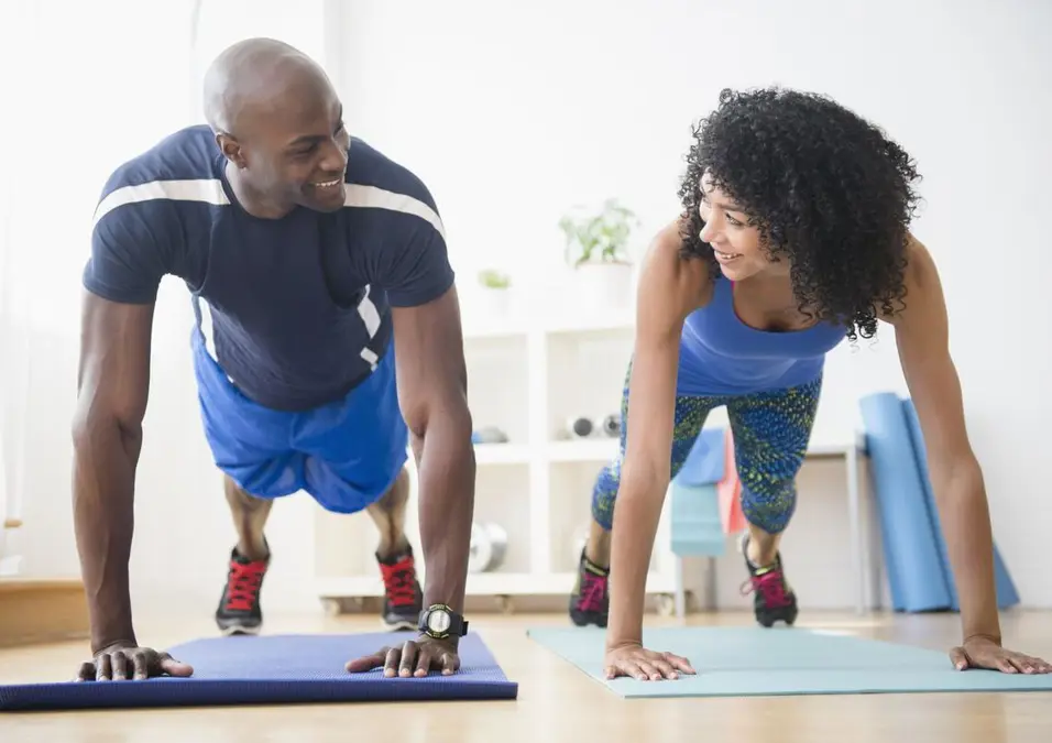 man and woman exercising