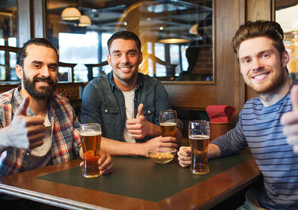 Three men drinking