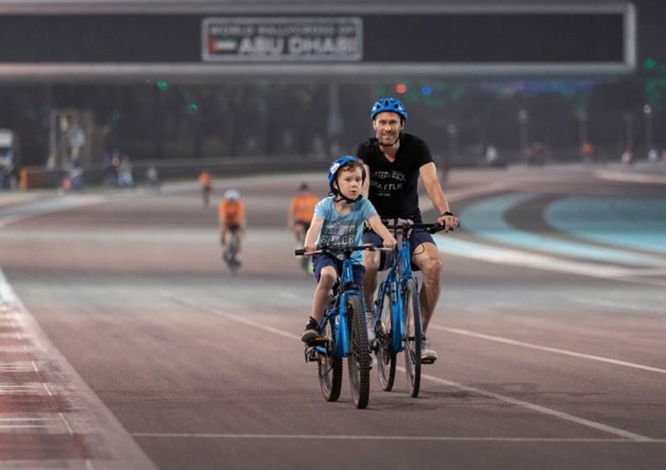 Man and young boy riding bicycles