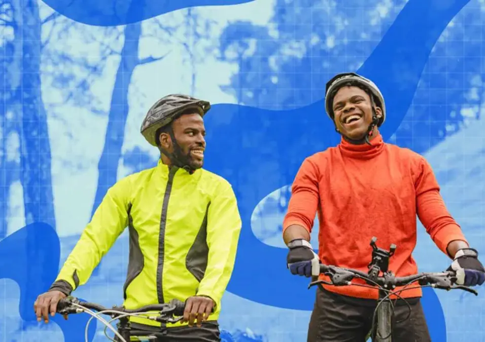 Two men riding bicycles