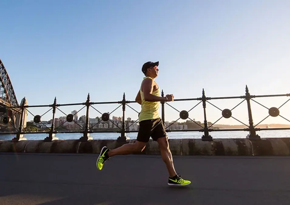 Man Jogging On Sidewalk By Thecity