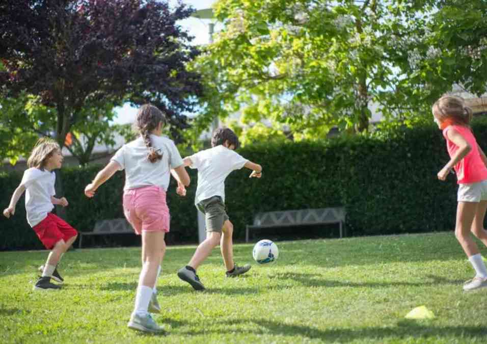 children playing football