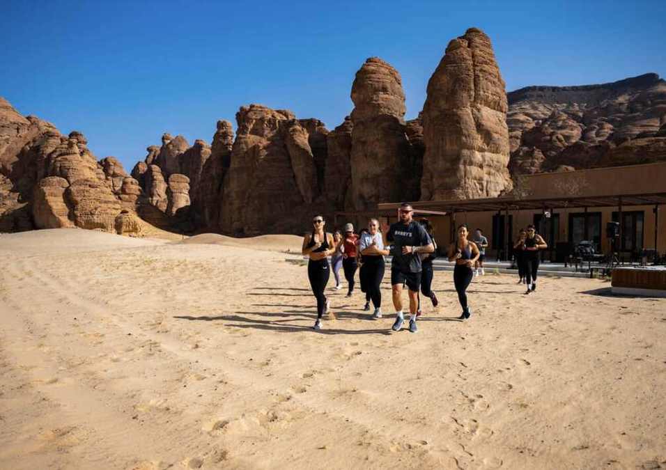 Group of people running in the desert