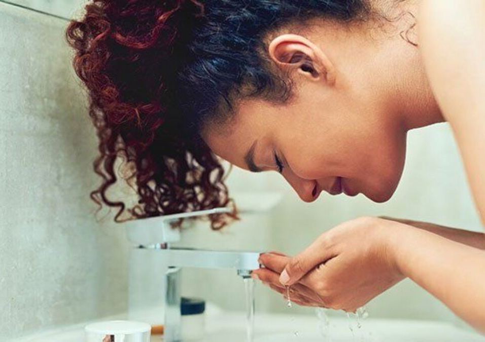 girl washing her face