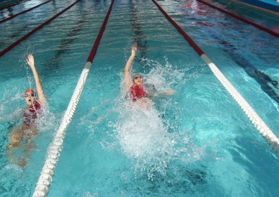 Two people swimming