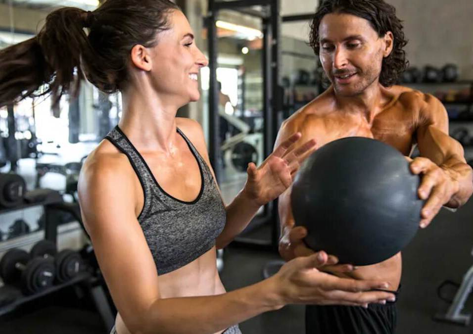 Girl & man IN the gym