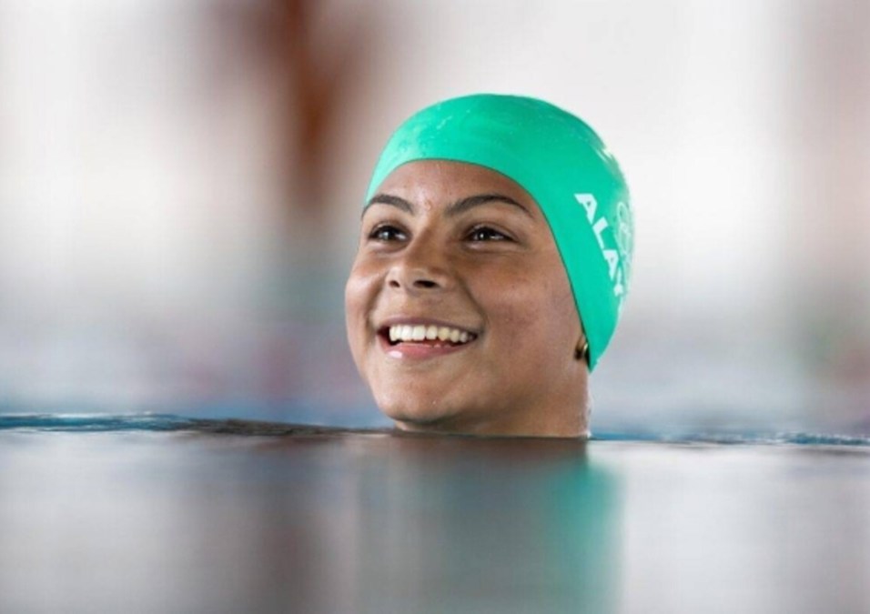 Girl coming out from under the water