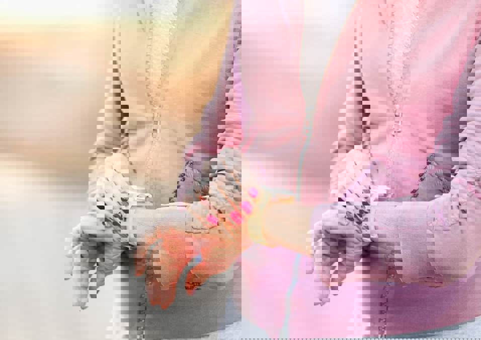 A woman looks at her watch