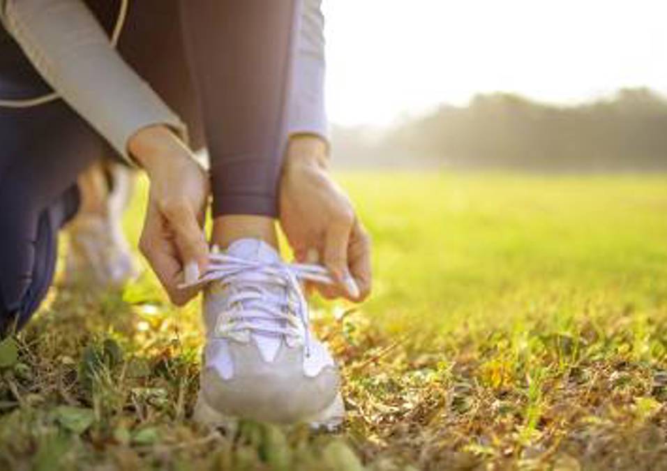 Girl tying her shoes