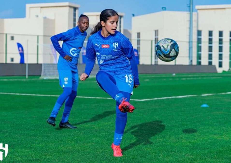 Girls playing football