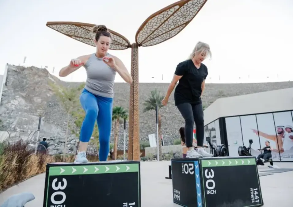 Two women participating in an outdoor fitness session during the Hatta Winter Festival