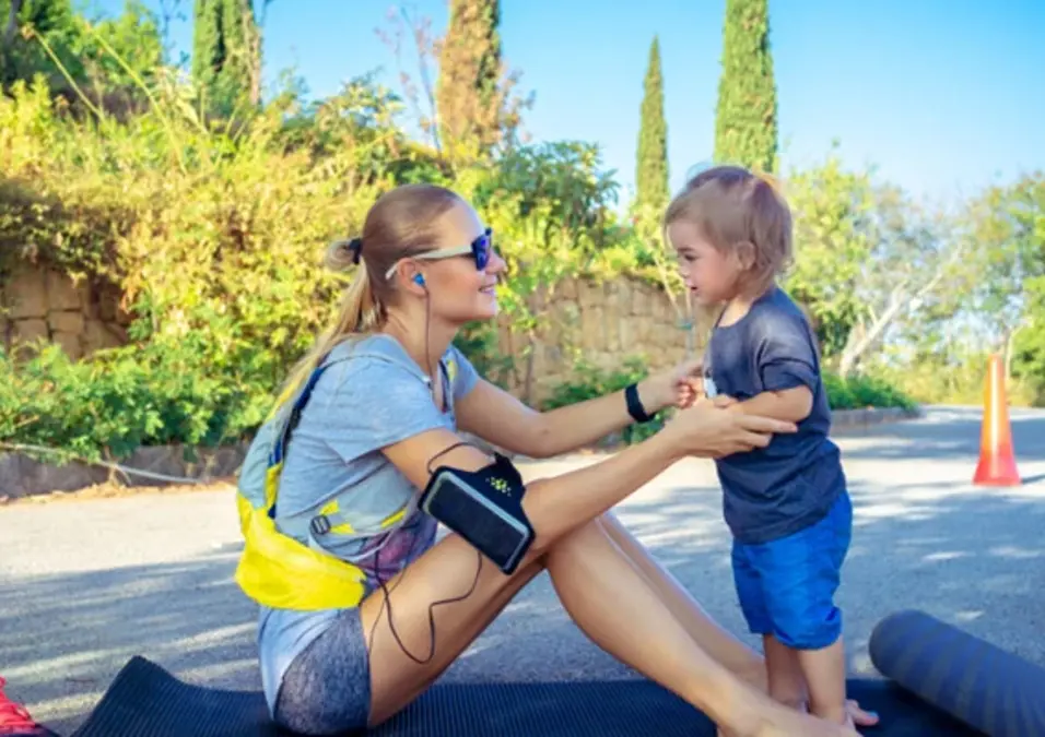 Sportive Mother With Little Baby