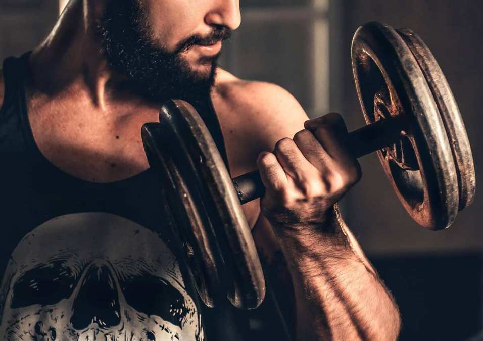 Athlete holding dumbbells