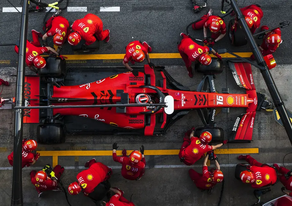 red F1 car with Driver and team