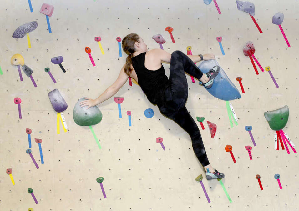 girl climbing wall