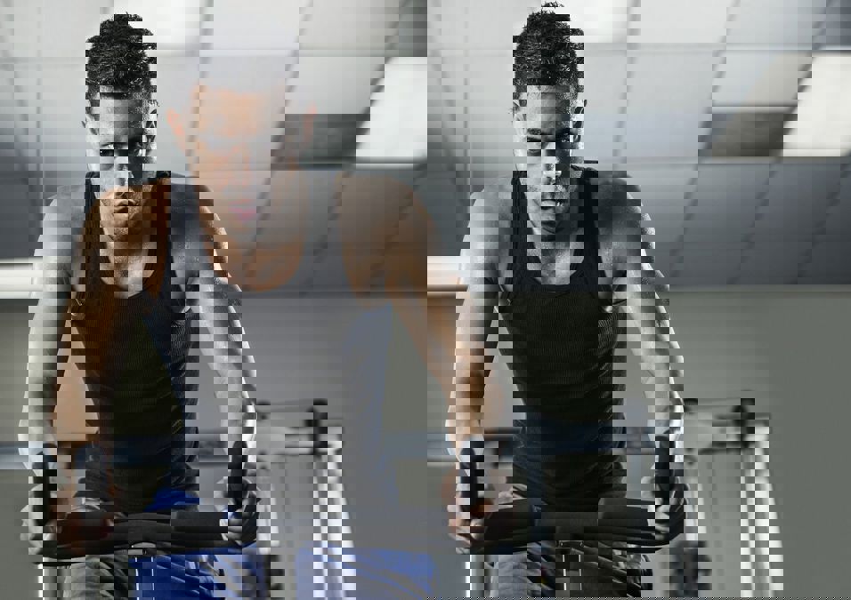 Young Man Training In Gym