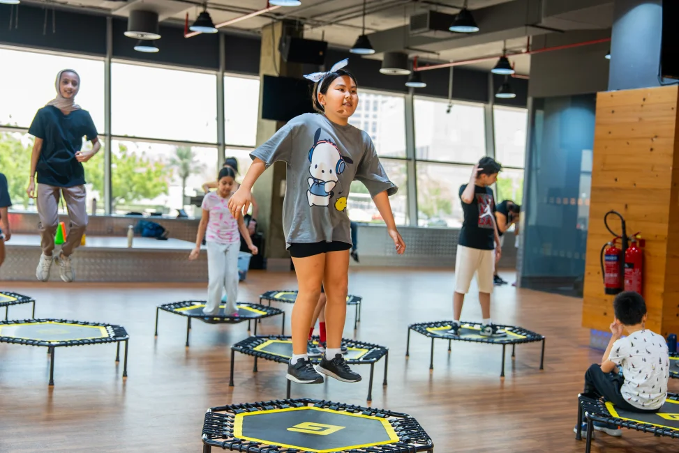 A trampoline-based cardio and strength class for kids at gymnation