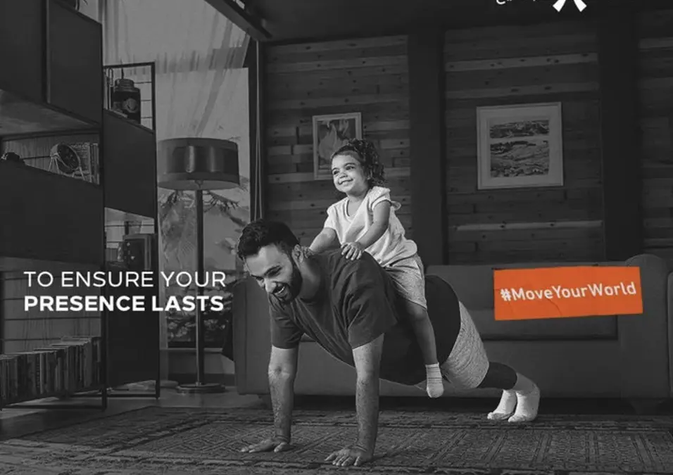 A father exercising with his daughter